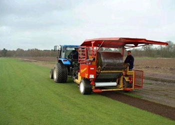 Modern farm equipment collecting turf in Northampton
